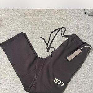 Fear of God Essentials Black Sweatpants with 1977 Graphic